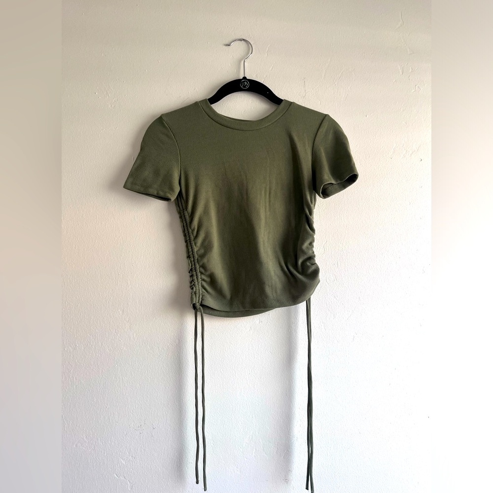 Zara top with ties that can cinch on the side. Can adjust length of top.